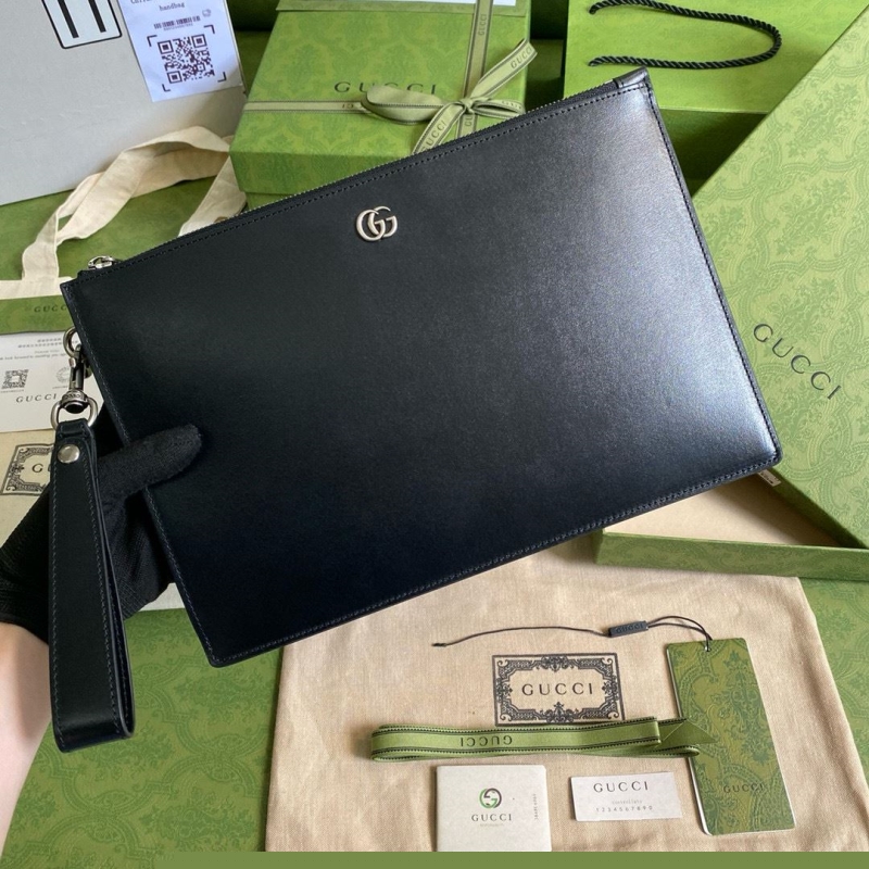 G*u*i clutch bags